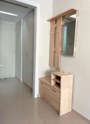 a bathroom with a wooden dresser and a mirror at Rhodes Central: King Bed Studio in Rhodes Town