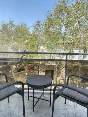 a patio with a table and chairs on a balcony at Rhodes Central: King Bed Studio in Rhodes Town