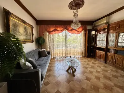 a living room with a couch and a table at Sunset apartment in Rhodes Town