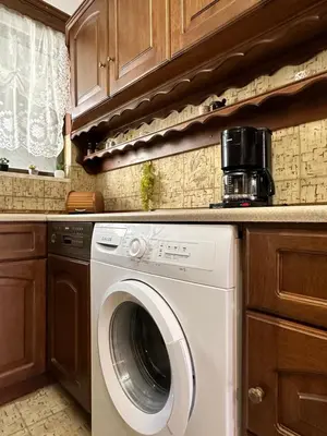 a kitchen with a washing machine in a kitchen at Sunset apartment in Rhodes Town