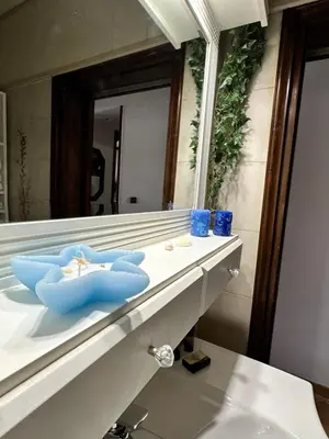 a bathroom with a sink and a mirror at Sunset apartment in Rhodes Town
