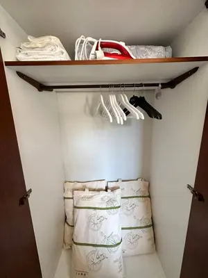 a walk in closet with towels on a shelf at Sunset apartment in Rhodes Town