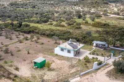an overhead view of a white house with a green roof at Petrino Eco Conscious Living in Kalithies
