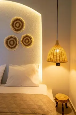 a bedroom with a bed and a lamp and a table at Hacienda tradition&relax in Afantou