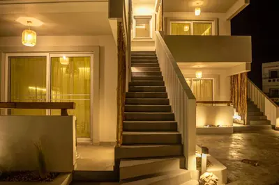 a staircase in a house at night with lights at Hacienda tradition&relax in Afantou