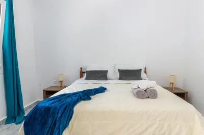 a bedroom with a bed with towels on it at (Stoa escape) traditional home in Archangelos