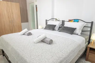 a bedroom with a bed with two pillows on it at (Stoa escape) traditional home in Archangelos