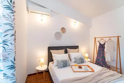 a bedroom with a bed with a tray on it at Ixian Bliss Pool Villa in Ialyssos