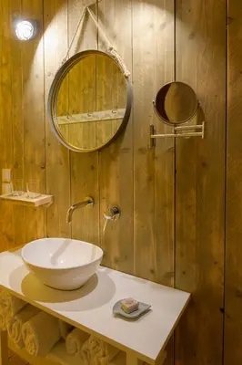 a bathroom with a sink and a mirror at LOGOS Beach Village in Theologos