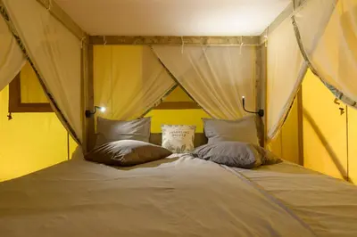 a bed with two pillows on top of it at LOGOS Beach Village in Theologos