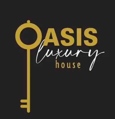 a yellow sign that reads cas luxury house and a key at Oasis Luxury House in Rhodes Town