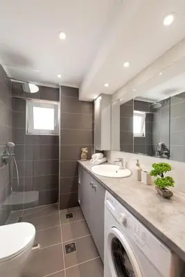 a bathroom with a sink and a washing machine at Modern Colorful House 2 rhodos in Rhodes Town